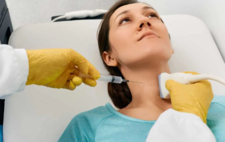 Medical professional in Lancaster performing a neck injection with ultrasound guidance, specializing as an FNA biopsy doctor Lancaster for precise fine needle aspiration procedures. | Cancer Biopsy & FNA Doctor in Los Angeles - Dr. Celina Nadelman