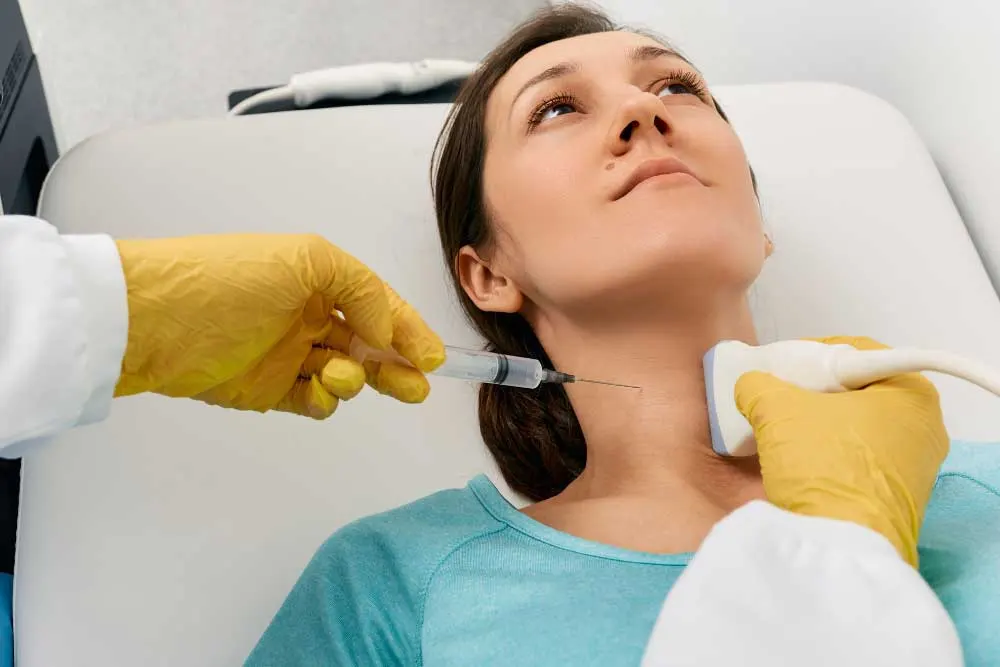 Medical professional in Lancaster performing a neck injection with ultrasound guidance, specializing as an FNA biopsy doctor Lancaster for precise fine needle aspiration procedures. | Cancer Biopsy & FNA Doctor in Los Angeles - Dr. Celina Nadelman
